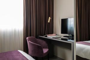 TV a/nebo společenská místnost v ubytování Urban Valley Resort & Spa