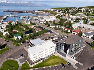 an aerial view of a city with a harbor at Fosshotel Husavik in Húsavík