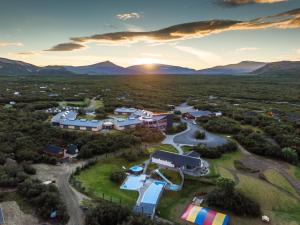 an aerial view of a resort with mountains in the background at Húsafell holiday homes in Húsafell