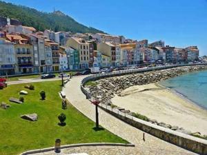 a view of a city with a beach and buildings at RINCON DO MAR ArenaBlanca in A Guarda