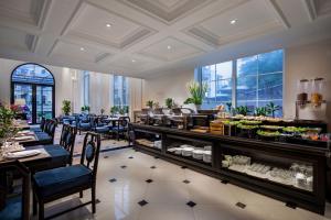 a restaurant with a buffet line with tables and chairs at My Boutique Hotel & Spa in Sa Pa