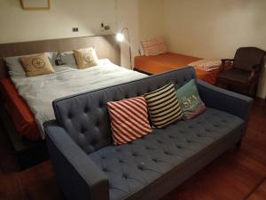 Voodi või voodid majutusasutuse Formosa Backpackers Hostel & Apartment（青年民宿） toas