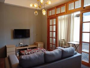 Televiisor ja/või meelelahutuskeskus majutusasutuses Formosa Backpackers Hostel & Apartment（青年民宿）