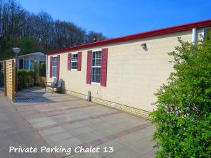 a building with a bench in front of it at dutchduochalet13 in 's-Gravenzande