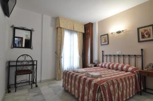 Voodi või voodid majutusasutuse Hostal Almanzor toas