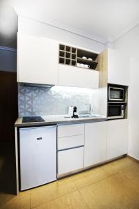 Virtuvė arba virtuvėlė apgyvendinimo įstaigoje Grey Rhino 1min From The White Tower