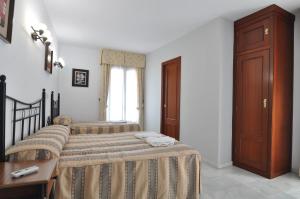 Voodi või voodid majutusasutuse Hostal Almanzor toas
