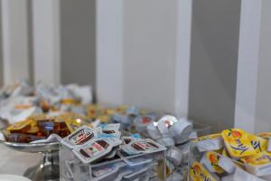 a table with a bunch of candy on it at Hotel Rex in Livorno