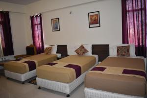 Cama o camas de una habitación en Hotel Bodh Vilas