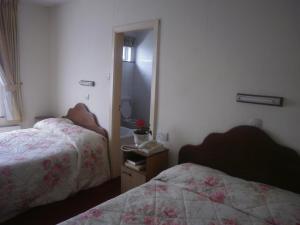 Postel nebo postele na pokoji v ubytování Sancta Maria Hotel