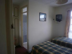 Postel nebo postele na pokoji v ubytování Sancta Maria Hotel