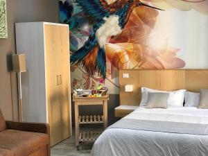 Łóżko lub łóżka w pokoju w obiekcie Parthenope Rooms