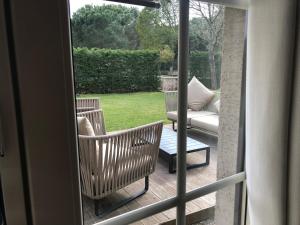 a view of a porch with a couch and a chair at Kemer Country Hotel İstanbul in Istanbul