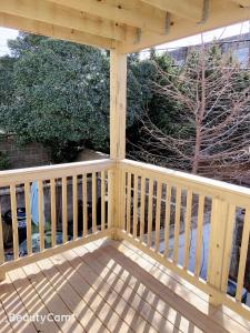a wooden gazebo with a wooden deck at Nice bedroom next fells point in Baltimore