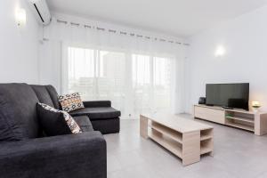 Гостиная зона в Três Castles Beach Apartment 3