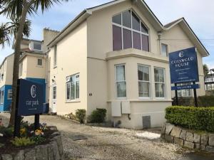 a house with signs in front of it at Cotswold House in Falmouth +14 photos
