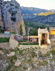 a house on the side of a mountain at Casa Jou in Abella de la Conca