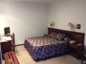 Postel nebo postele na pokoji v ubytování Hotel O Castelo