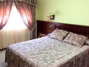 Postel nebo postele na pokoji v ubytování Hotel O Castelo + 30 fotografií
