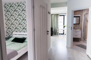 Posteľ alebo postele v izbe v ubytovaní Zielone Apartamenty