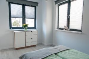 Posteľ alebo postele v izbe v ubytovaní Zielone Apartamenty