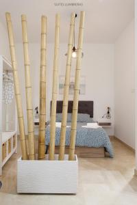 Postel nebo postele na pokoji v ubytování Suites Lumbreras