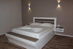 Postel nebo postele na pokoji v ubytování Palmanova Beach Mardok