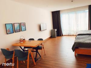 Postel nebo postele na pokoji v ubytování Nếp Apartment Hotel