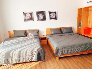 Postel nebo postele na pokoji v ubytování Nếp Apartment Hotel