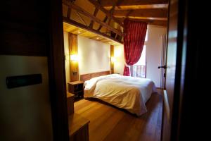 Posteľ alebo postele v izbe v ubytovaní Le Petit Coeur Residence De Montagne
