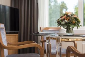 Uma televisão e/ou sistema de entretenimento em Maritim Hotel Stuttgart