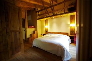 Posteľ alebo postele v izbe v ubytovaní Le Petit Coeur Residence De Montagne