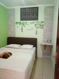 Letto o letti in una camera di nDalem Eyang Dwijo