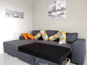 a couch with pillows on it in a living room at Ocean View Apartment in Adeje