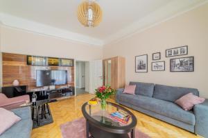 a living room with a couch and a table at Rumbach Residence in Budapest