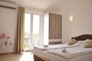 Postel nebo postele na pokoji v ubytování Guest House Damjana