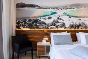 Postel nebo postele na pokoji v ubytování Atrium Ambiance Hotel