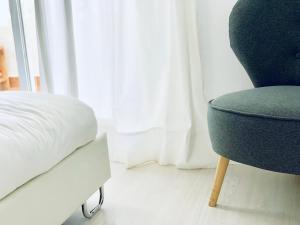 Łóżko lub łóżka w pokoju w obiekcie Laguna Beach, Todos los Santos
