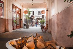 an empty street with a tub with lights in it at Rumbach Residence in Budapest