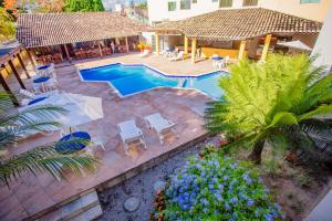 Bazén v ubytování Rede Andrade Estrela Dalva Centro Hotel nebo v jeho okolí