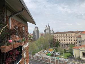 a view of a city from a balcony of a building at Kibilù - Via Cimabue in Milan