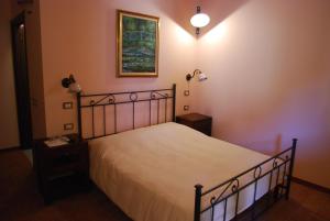 Posteľ alebo postele v izbe v ubytovaní Agriturismo Cascina Madonnina + 19 fotografií