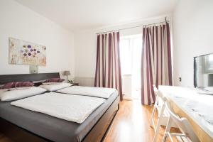 Ένα ή περισσότερα κρεβάτια σε δωμάτιο στο Pension Rosenhof