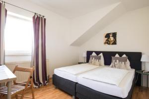Ένα ή περισσότερα κρεβάτια σε δωμάτιο στο Pension Rosenhof