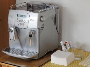 a coffee maker sitting on top of a table at Ferienhaus Sunny in Gengenbach