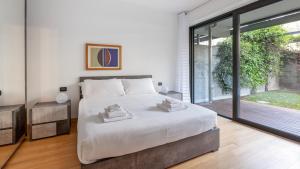 Кровать или кровати в номере Italianway - Traiano 37