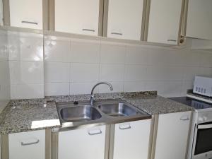 Kuchyňa alebo kuchynka v ubytovaní LAS AMERICAS DE GANDIA Residencial ( Alquiler solo Familias )
