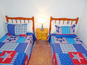 Posteľ alebo postele v izbe v ubytovaní LAS AMERICAS DE GANDIA Residencial ( Alquiler solo Familias )
