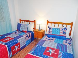 Posteľ alebo postele v izbe v ubytovaní LAS AMERICAS DE GANDIA Residencial ( Alquiler solo Familias )