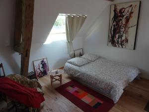 Ένα ή περισσότερα κρεβάτια σε δωμάτιο στο L'escalier des rêves gîte